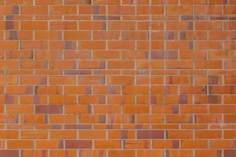 Background of aged orange and red brick wall. Brick background Stock Photos