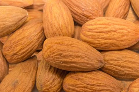Background of the almonds peeled from shells closeup Stock Photos