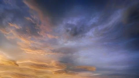 Background of amazing cloudscape with dramatic sunset clouds in sky Stock Photos
