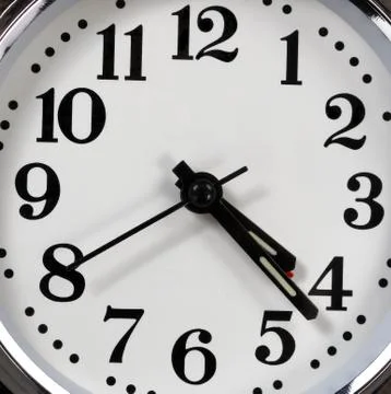 Background of analog clock in close up view Stock Photos