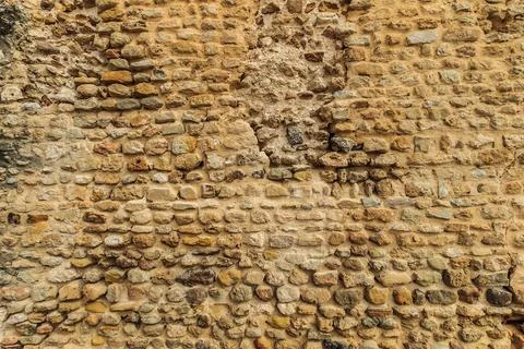 Background of ancient stone wall. Texture of old brick. Stock Photos