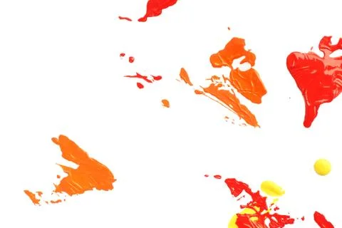 Background and texture blots of red, orange and yellow paint on white paper.  Stock Photos