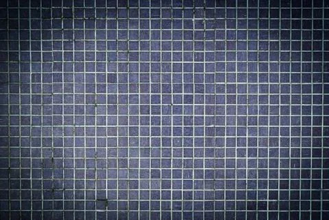 The background and texture of dark blue mosaic brick square wall pattern Stock Photos
