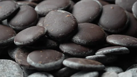 Background and texture dark chocolate chips, close up, rotates Stock Footage 300393516
