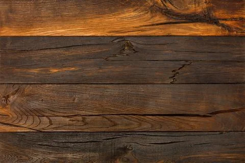 Background and texture of dark old wood with cracks and knots. Stock-Fotos