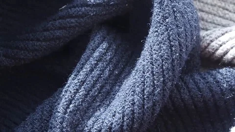 Background and texture of knitted woolen gray blue sweater. Carelessly rumpled. Stock Footage 128697961