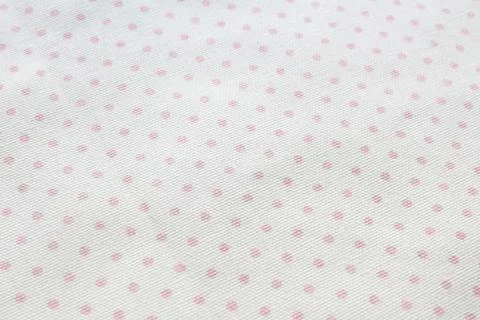 Background and texture light gray cotton fabric with dusty pink polka dots... Stock Photos