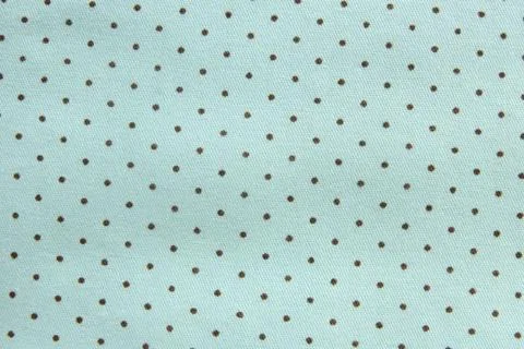 .Background and texture of mint cotton fabric with brown polka dots... Stock Photos