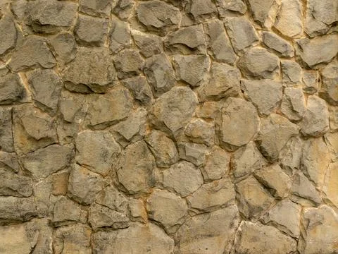 Background and texture. The wall is lined with gray natural stone. Stock-Fotos