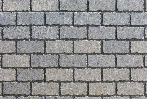 The background and texture of the wall is tiled with rectangular stone tile.. Stock Photos