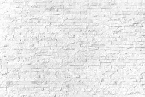 Background and texture white brick stone cladding wall. Stock Photos
