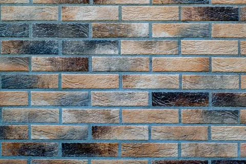 Background, area of multicolored bricks, used old bricks 스톡 사진
