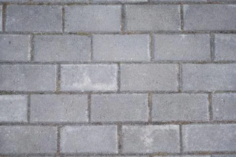 Background of asphalt gray rectangular tiles. Stock Photos