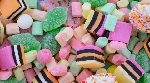 Background of assorted candy, rotating, overhead. Stock Footage 62698324