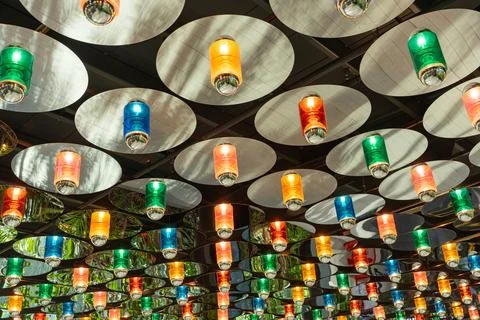 Background, backdrop. Many circular sheets with colors lamps. Stock Photos