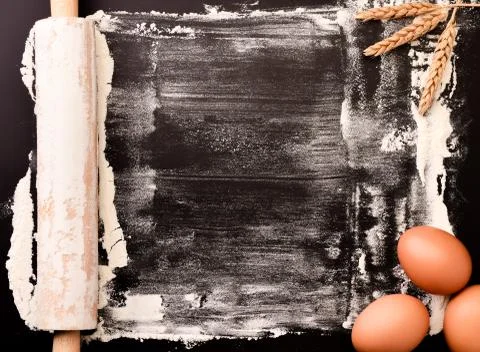 Background of baking flour, rolling pin, eggs and spikelets. The view from th Stock Photos