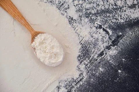 Background for baking - flour sprinkled on the table Stock Photos