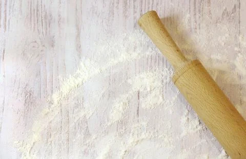 Background for baking with space for text. Rolling pin and flour Stock Photos