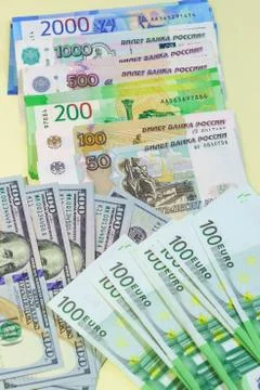 Background of banknotes from different countries spread out on table: Russian Stock-Fotos
