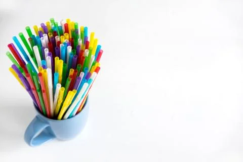 Background for a banner with plastic tubes in the cup. Frame for a banner wit Stock Photos