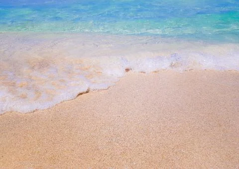 Background beach with sea wave. Texture sand. Gentle pastel colors. Vintage f Stock Photos