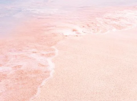 Background beach with sea wave. Texture sand. Gentle pastel colors. Vintage f Stock Photos