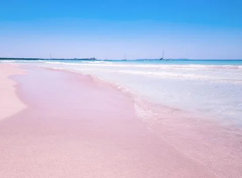 Background beach with sea wave. Texture sand. Gentle pastel colors. Vintage f Stock Photos