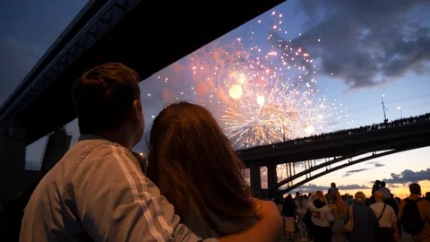 Background beautiful bright firework man and woman standing nearby enjoy show 4K Stock Footage 114329013