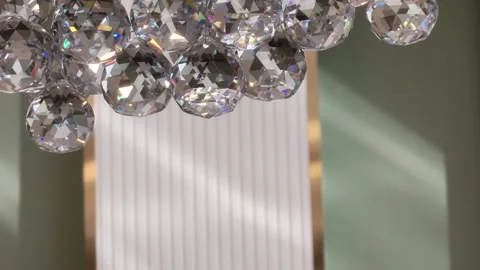 Background of beautiful crystal chandeliers casting a warm light 動画素材 324599136