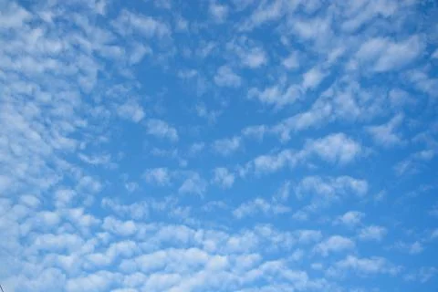 Background of beautiful stratocumulus clouds on blue sky Stock Photos