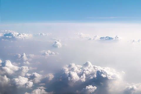 Background beautiful white dramatic clouds in a blue sky. Top view from an Stock Photos