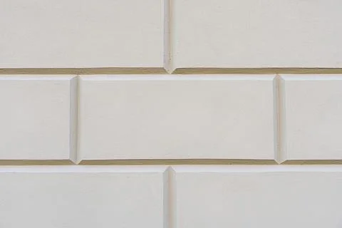 Background of a beige stone wall with rectangular stones 스톡 사진