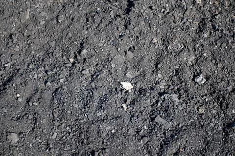 Background of black coal surface Stock Photos