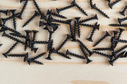 Background. Black hardware on a light wood background Stock Photos