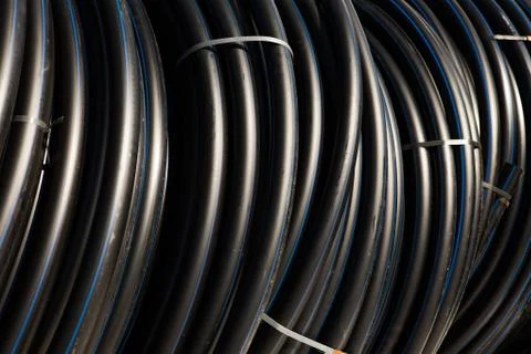 Background of black plastic pipes Stock Photos