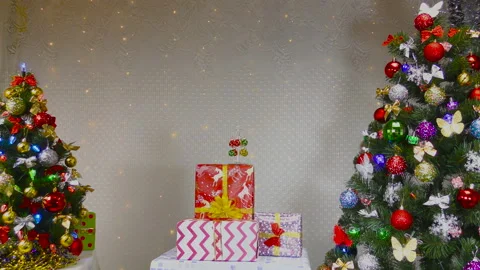 On the background with blinking lights, gifts between the newfangled trees Stock Footage 146644105