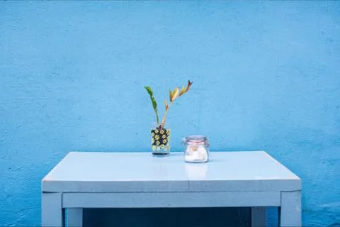 Background of blue home wall with table Stock Photos