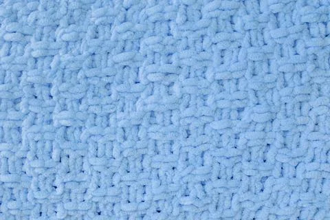 Background of blue knitted plaid. Stock Photos