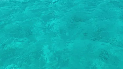 Background with blue ripples and waves on the water surface. Waves reflecting li Stock Footage 334178555