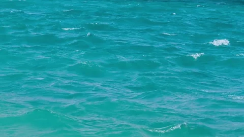 Background with blue ripples and waves on the water surface. Waves reflecting li Stock Footage 334230588
