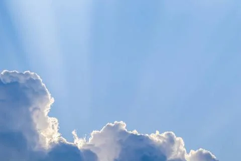  Background from blue sky with sun rays across clouds Background from blue... Stock Photos