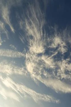 Background of blue sky veiled by white cirrus clouds Stock Photos