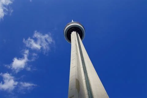 Background with blue sky, white clouds and sunny CN Tower Stock Photos
