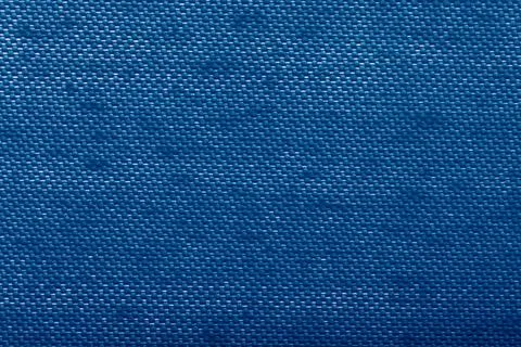 Background of blue textile texture. Seamless pattern. Macro photo Stock Photos
