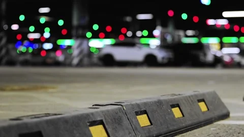 Background, blur, out of focus, bokeh. Bright reflectors on concrete, Nighttime Stock Footage 321757359