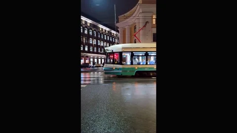 Background, blur, out of focus, sideways. Beautifully illuminated city tram at Stock Footage 323181703