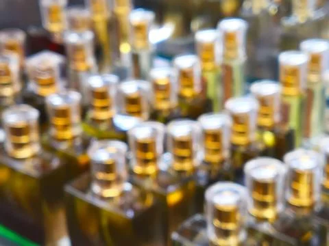 Background with blurred aromatic perfume bottles Fotos Stock
