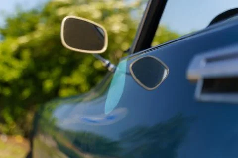 Background blurred image with a view of the left side mirror of the Citroen.. Stock Photos