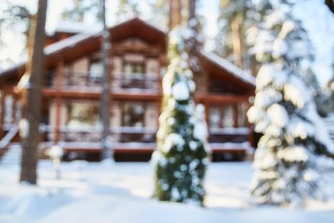 Background with blurred with a large winter house. Stock Photos