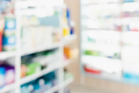 Background of blurred qualified pharmacy abstract background with drugs on shelf Foto stock